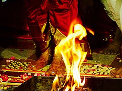 A wedding is the most extensive personal ritual an adult Hindu undertakes in their life. A typical Hindu wedding is solemnised before Vedic fire ritual (shown).[346]