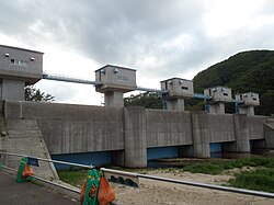 While the tsunami was able to surmount sea walls and floodgates in many areas along the coastline of the Tohoku region, Fudai, Iwate, was spared destruction due to its 15.5-meter (51 ft) floodgate, which successfully withstood the waves.[153]