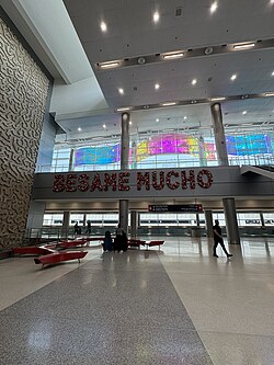 "Bésame Mucho" sign at the international arrivals of the South Terminal of the airport.