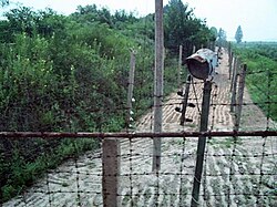 DMZ, North Korea. Electric fences are used as a means to seal North Korea off from South Korea. Behind the fence is a strip of land mines.