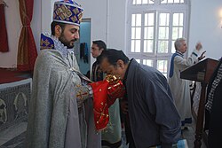 A Kolkata Armenian kisses the hand of St John the Baptist at Chinsurah.