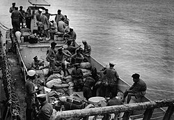 Royal Indian Naval personnel on board a landing craft during combined operations off Myebon, Burma, January 1945.