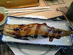 Yaki anago-ippon-nigiri (焼きアナゴ一本握り) – a roasted and sweet-sauced whole conger eel