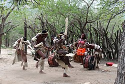 Zulus perform a traditional dance.
