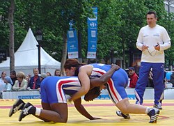 Women competing in a freestyle wrestling match