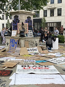 The empty pedestal of the statue of Edward Colston in Bristol. Subject to increasing controversy since the 1990s, when his prior reputation as a philanthropist came under scrutiny due to a growing awareness of his slave trading, in June 2020, the statue was toppled, defaced and pushed into Bristol Harbour.