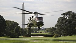 A developmental VH-92A helicopter conducts landing and take-off testing at the White House South Lawn in front of the Washington Monument in September 2018