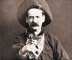 Justus D. Barnes, in Western apparel, from the silent film The Great Train Robbery (1903), the second Western film and the first one shot in the United States