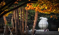 The Tiger Statue, erected in February 1965 with funds raised by Korea University students. The stone statue features a tiger seated atop a globe, symbolizing the KU community's aspiration to lead and inspire the world