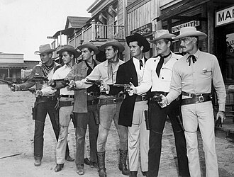 Publicity still with 1959 Warner Bros. Western series leads Will Hutchins (Sugarfoot), Peter Brown (Lawman), Jack Kelly (Maverick), Ty Hardin (Bronco), James Garner (Maverick), Wayde Preston (Colt .45), and John Russell (Lawman)