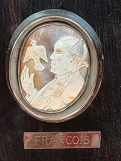 Pope Francis cameo ivory on wood carving at Notre Dame de Paris, France