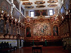 Sacristy of the colonial Basilica of San Pedro of Lima. The painting by Bernardo Bitti in the background.