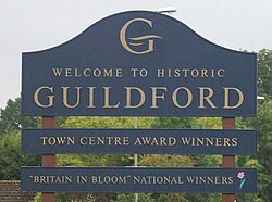 Guildford welcome sign displaying Britain in Bloom credentials