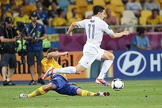 Nasri dribbles past a Sweden defender at UEFA Euro 2012