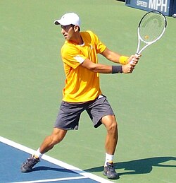 Novak Djokovic in a two-handed backhand motion