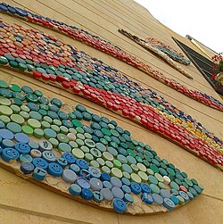 A detail of mosaic mural made of bottle screw tops. A high school in Jerusalem.