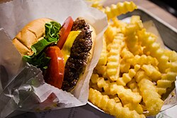 A ShackBurger served with crinkle-cut french fries