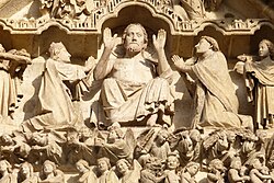 A sculpture depicting the judgment of sinners by Jesus at Amiens Cathedral, France