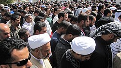 Bahrainis observing public prayers in Manama