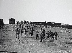 Forced transfer and displacement. Syrian civilians, hands raised, before Israeli soldiers, leave their homes in the Golan Heights.
