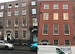 Restoration (before and after) of a Georgian brick facade in Limerick, re-pointed in Irish Wigging, using hybrid lime mix mortar, after replacing damaged bricks with matching salvaged bricks
