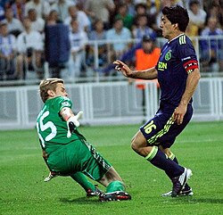 Maksym Koval (left) closes down Luis Suárez.