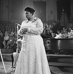 Photo of Mahalia Jackson performing at a concert in 1961.