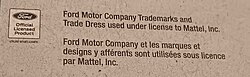 A merchandise licensing disclaimer printed on the back of Hot Wheels packaging