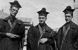 Enrico Fermi between Franco Rasetti (left) and Emilio Segrè in academic dress