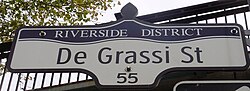 A De Grassi Street sign.