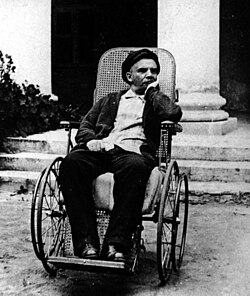 Lenin in a wheelchair shortly after his third stroke in March 1923
