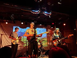A band plays live music for an audience in Montreal, Canada