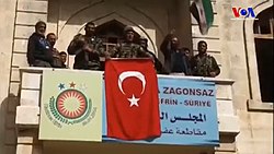 Turkish soldiers and TFSA fighters at the building in Afrin that had hosted the PYD-led government of the region, 18 March 2018