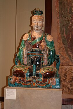 Chinese glazed stoneware statue of a Daoist deity, from the Ming dynasty, 16th century