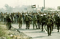 Israeli soldiers opposite Palestinian protesters in the strip during the First Intifada in 1987