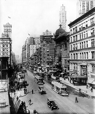 Broadway north from 38th St., New York City, showing the Casino and Knickerbocker Theatres ("Listen, Lester", visible at lower right, played the Knickerbocker from December 23, 1918, to August 16, 1919), a sign pointing to Maxine Elliott's Theatre, which is out of view on 39th Street, and a sign advertising the Winter Garden Theatre, which is out of view at 50th Street. All but the Winter Garden are demolished. The old Metropolitan Opera House and the old Times Tower are visible on the left.