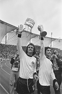 Müller (right) celebrating after winning the 1974 FIFA World Cup. To his left is Wolfgang Overath.