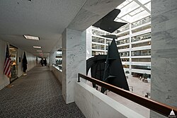 Walkway arcades on each floor provide access to the offices of the Hart building, as well as a view of the atrium. A portion of Mountains and Clouds can be seen in this image.