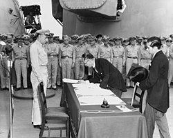Japanese foreign affairs minister Mamoru Shigemitsu signs the Japanese Instrument of Surrender on board USS Missouri, 2 September 1945