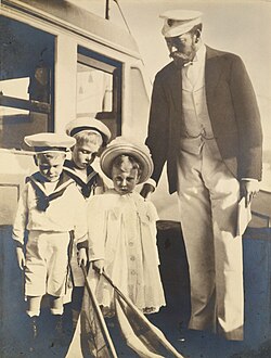 With his children, Edward, Albert, and Mary. Photograph by his mother Alexandra, 1899.