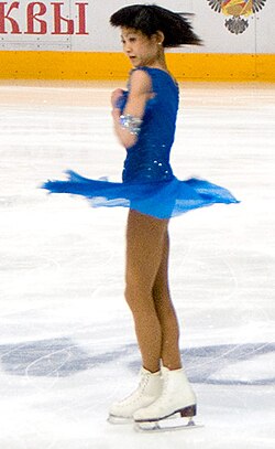 A figure skater in a spin uses conservation of angular momentum – decreasing her moment of inertia by drawing in her arms and legs increases her rotational speed.