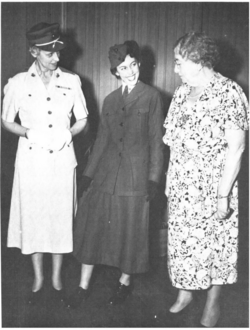 Sergeant Opha Johnson (far right) in 1946, with Colonel Katherine Towle (far left). They are looking at Opha Johnson's uniform being worn by PFC Muriel Albert.