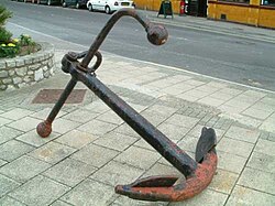 An Admiralty Pattern anchor; when deployed on the seafloor the stock forces one of its flukes into the bottom.