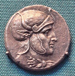 Coin of Seleucus I Nicator, showing the king wearing a helmet decorated with leopard skin and bull's horn and ear.