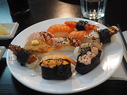 Eleven pieces of nigirizushi at a sushi buffet in Helsinki, Finland