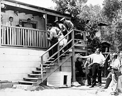 Los Angeles County Sheriffs forcibly evicting Aurora Vargas from her home on Malvina Avenue in Chávez Ravine, as part of the "Battle of Chavez Ravine"