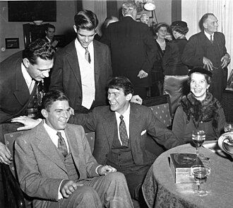 The Pauling children at a gathering in celebration of the 1954 Nobel Prizes in Stockholm, Sweden. Seated from left: Linus Pauling, Jr., Peter Pauling and Linda Pauling. Standing from left: an unidentified person, and Crellin Pauling