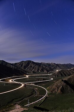 Guanjiao Spiral on Qinghai–Tibet Railway at night. The route containing the spiral was replaced by a 32-km long tunnel (at the time of completion the longest in China) in 2014.