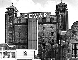 Dewar's Centre, an ice rink, stands on the site formerly occupied by a bonded warehouse for Dewar's Scotch whisky, pictured here in 1988, shortly before its demolition.