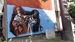 A grafitti in Belgrade, Serbia, depicting apocryphal events at the First Council of Nicaea. The text reads "St. Nicholas at the council in Nicaea in the year 325 stops the great lie of the heretic Arius who convinced the people that Jesus Christ is not God".